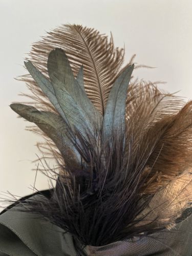 Detail of the feathers.  The silver rooster tail feathers add a luxe touch.
