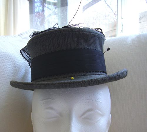 Grey tweed topper made in 2008.  This buckram crown was made on the bias, and the brim edge has two sets of wires creating the curled edge.