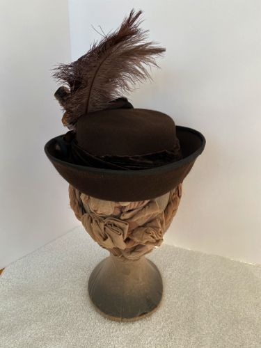 The brim is turned up all around and the edge was wired then bound with a vintage satin fabric.
