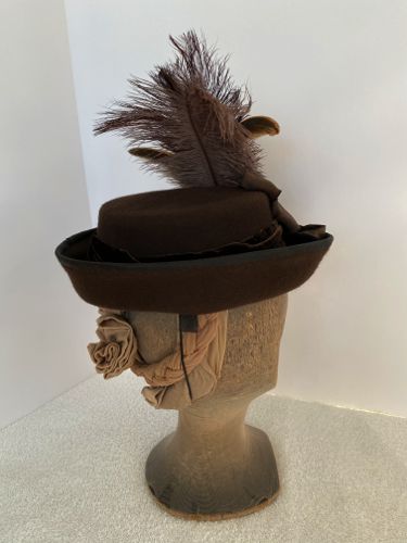 Horsehair tabs and an elastic for securing the hat to the hair were stitched in before the petersham ribbon was attached.