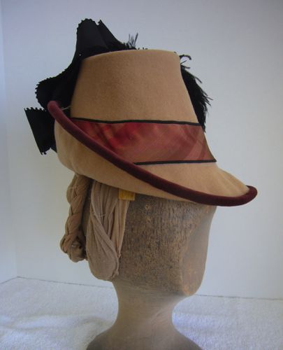 The hat was blocked over an upturned galvanized bucket.  The brim was wired and covered with velvet bias, the band is piped bias striped silk.
