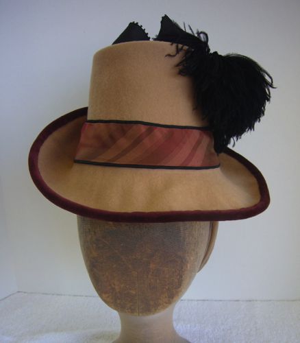 Created for the character of Arabella on the TV show Hell On Wheels, this felt hat is an example of the Flowerpot style very popular in 1884.