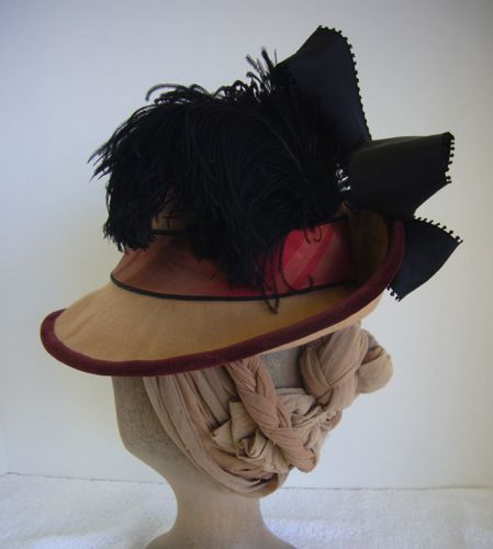 Black and brown ostrich feathers also trim this hat.