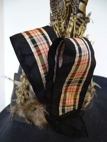 Black silk taffeta and plaid ribbons were combined to create loops.  The inside of the loops were also trimmed with the plaid ribbon.