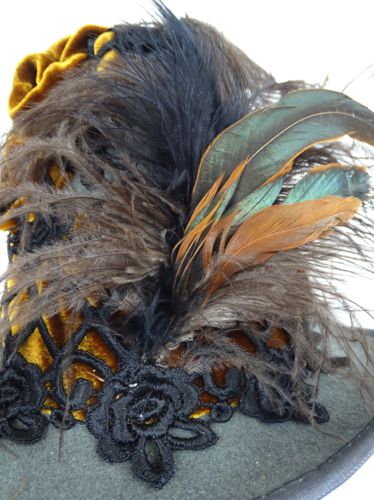 Detailed view of the feathers at the front of the hat.