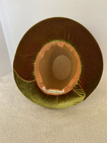 The underside of the brim has been lined with two-toned velvet cut on the bias.