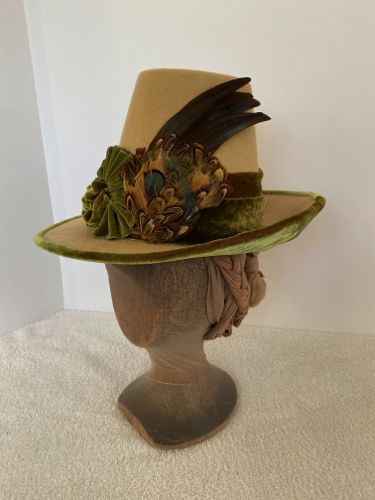 This hat has a very tall crown - 6 1/2", but that is balanced by the 2 1/2" brim.