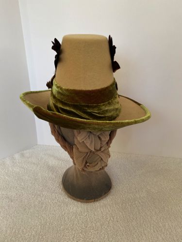 The very stiff felt brim was cut in three places and sewn back together to create the turn up.