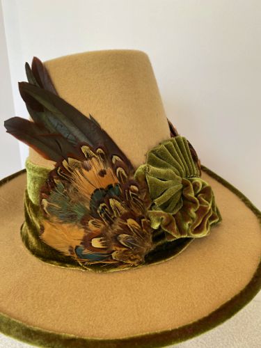 The "wings" were fashioned from two types of feather pads utilizing rooster, pheasant and peacock feathers.
