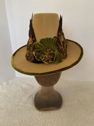 The underside of the wired brim was covered with silk shot velvet.