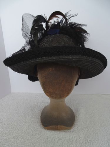 This straw hat is made from straw braid that was subsequently painted grey.