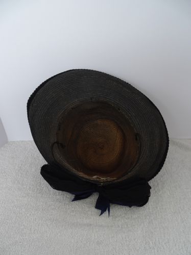 View of the inside of this hat shows the original color of the straw.
