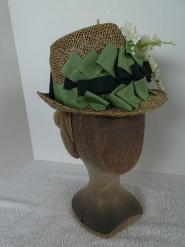 Made for a stage production in 2018, this straw hat's crown was blocked on a vintage wooden hat block, and the brim was shaped by hand.