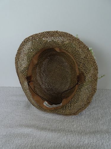 This hat was left unlined for ventilation, but a ribbon band and horsehair loops were provided for the actress to pin it to her hair.