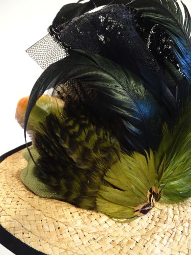 Detail of the many feathers in the front: rooster tails, pheasant, and goose nagoire in shades of green and blue were layered with net loops.