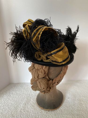 Several vintage and contemporary black ostrich feathers were tucked in amongst the loops.