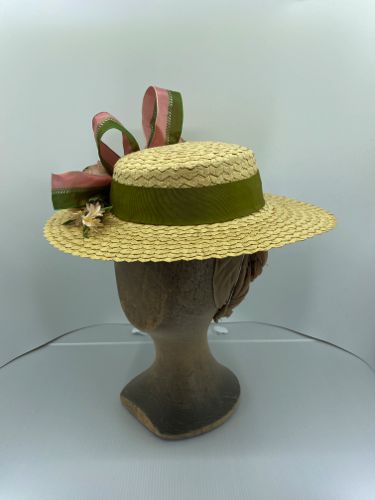 This hat started as a modern high crowned sunhat, but the straw was unpicked and re-stitched to this shape.