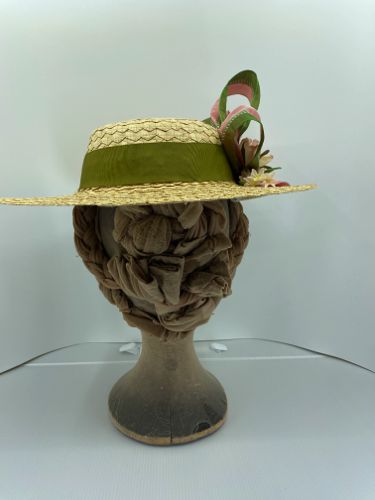The hat band is made from an olive-green Petersham ribbon.