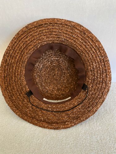 Inside view of the hat, showing horse-hair/crinoline tabs and elastic, plus inner Petersham ribbon hatband.