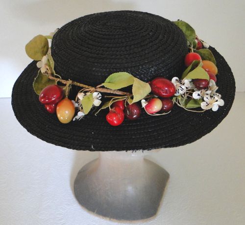 The straw is not in mint condition, but this hat has a slightly “shabby chic” charm.