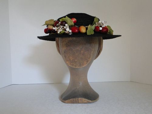 This black straw boater with fruit is suitable for the 1890’s and used to be a child’s cowboy hat!