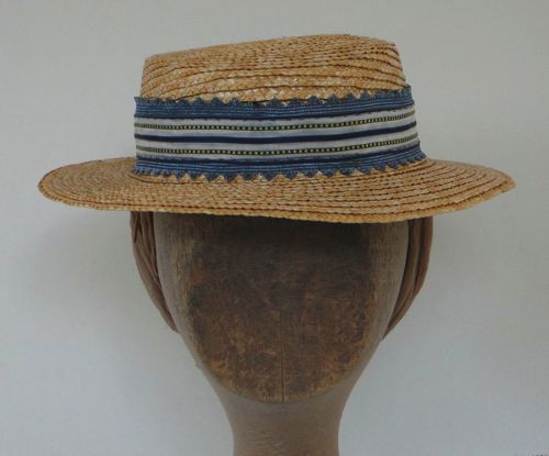 Three kinds of ribbon form the band of this tiny straw boater made for "Klondike" in 2013.