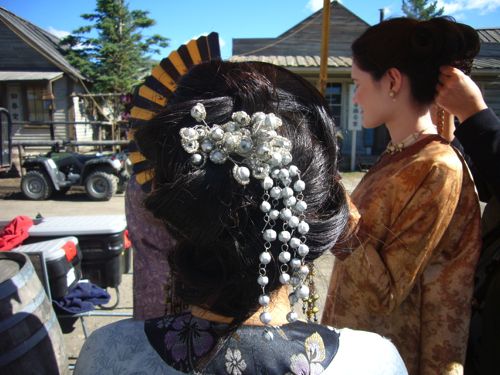 This hair decoration was created from a tangled piece of trim found in the costume designer's trimmings box,